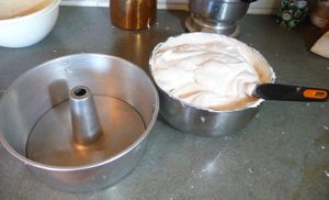 Putting the angel food cake batter into pan