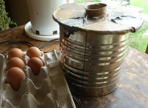 Photo of eggs with metal can on table