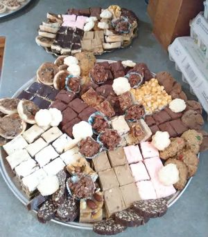 Photo of cookies and cakes on a plate with cracked egg cartons