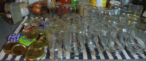 washed and rinsed odd shaped glass jars ready for filling for vegan beans