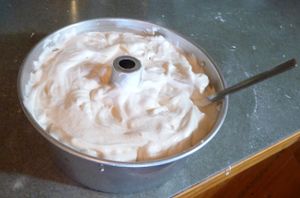 Running a knife through baking from scratch angel food cake
