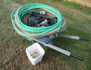 Photo of water pump in wheel barrow for pumping rainwater