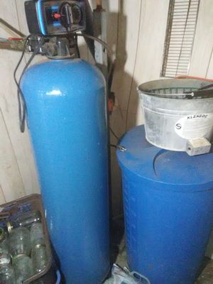 Photo of blue water softener and blue tank