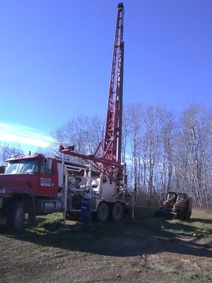 Well its a well - well drilling contractor setting up equipment