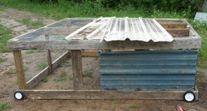 metal attached to the DIY moveable chicken coop AKA chicken tractor