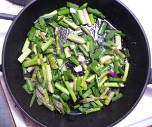 Photo of cast iron fry pan with edible wild greens