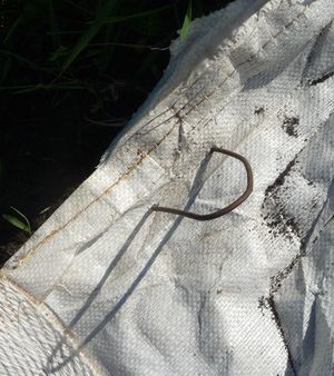 Woven landscape fabric - putting in staples