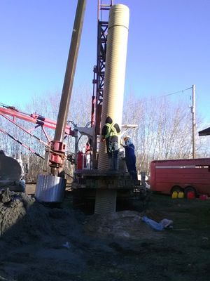 Well its a well - well drilling contractor lowering well casing into place