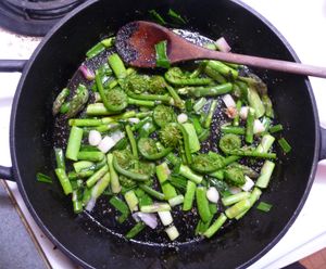 Photo of cast iron fry pan with edible wild greens