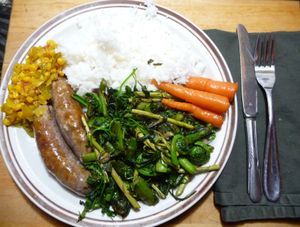 Photo of completed edible wild greens for supper with cutlery