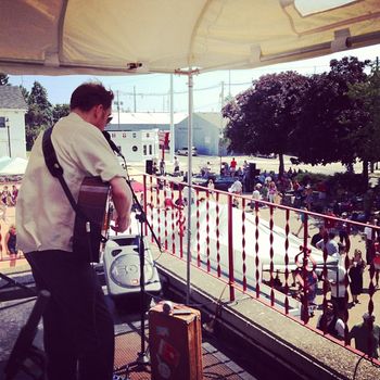 Delaney Davidson plays to the crowd from the balcony of the Holiday Music Motel - photo by Ty Helbach

