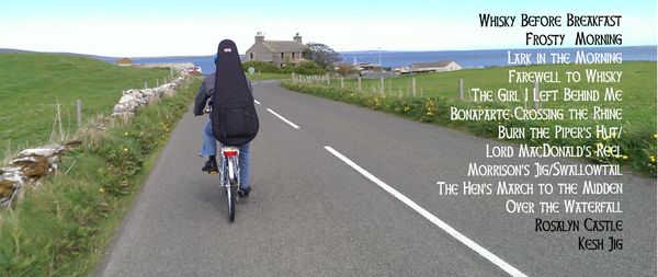 Tim & Maggie biked across Orkney.

Maggie carried a backpack with clothes; Tim carried a backpack with instruments.

This was Maggie's view when Tim had the lead.