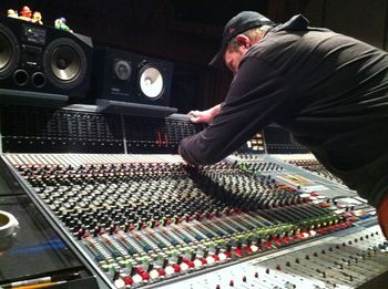 Paul Williams hovering over the Neve board at Audio Dallas Studio
