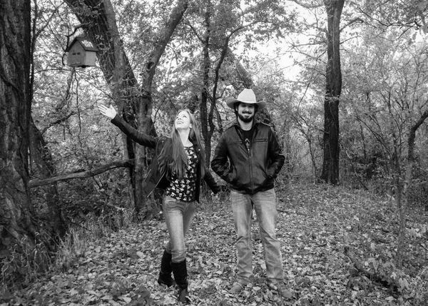 Aaron and Angi frolicking in the woods behind their home. 
