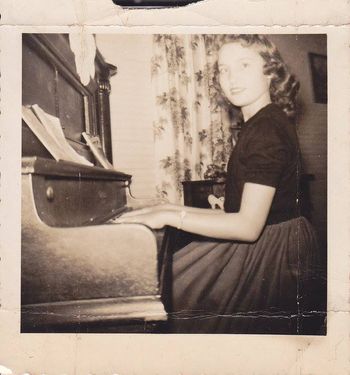 Ann at the piano where she learned to play

