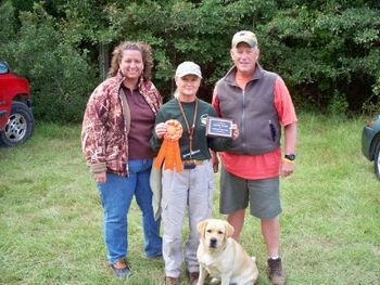 AKC Judges Michelle Love and Robert Rasco pose for a shot with Angie and Grace after presenting Grace with her Senior Hunter title in October, 2009.
