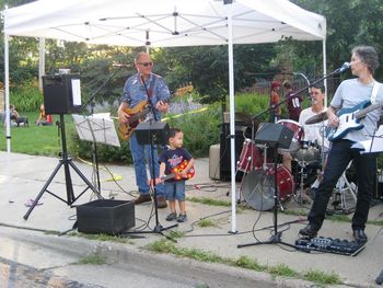 We often invite guests to sit in with the band. Usually they are taller than this little kid.
