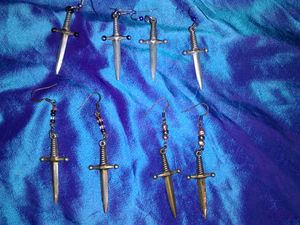 2 sets Pewter Dagger Earrings (1 with sharp points & 1 blue bead; 1 with black-painted hilts); 2 sets Brass-Colored Dagger Earrings (1 with copper-colored beads, 1 with pink pearl & brass-colored beads) - $20