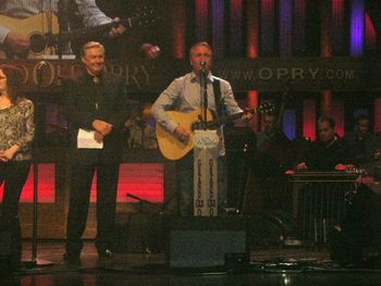 Singing on the Grand Ole Opry with Jim Ed Brown looking on.
