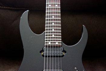 (12/10/13) This is one of my favorite 7 strings ever. It is a Ibanez RG7621, Made In Japan. Ibanez made these from 1998 to 2002. It has a Basswood body and Maple neck with Rosewood fretborad. It has DiMarzio Blaze pickups in the neck and bridge. I upgraded the turners to locking Sperzels. I have owned and played a lot of 7 strings and there is something that Ibanez just got right with these. It has nice tight low end and plays great and with the fixed bridge stays in tune. This has always been my go to recording 7 string.
