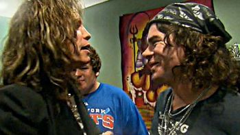 Steven Tyler talking to Jay Conroy backstage
